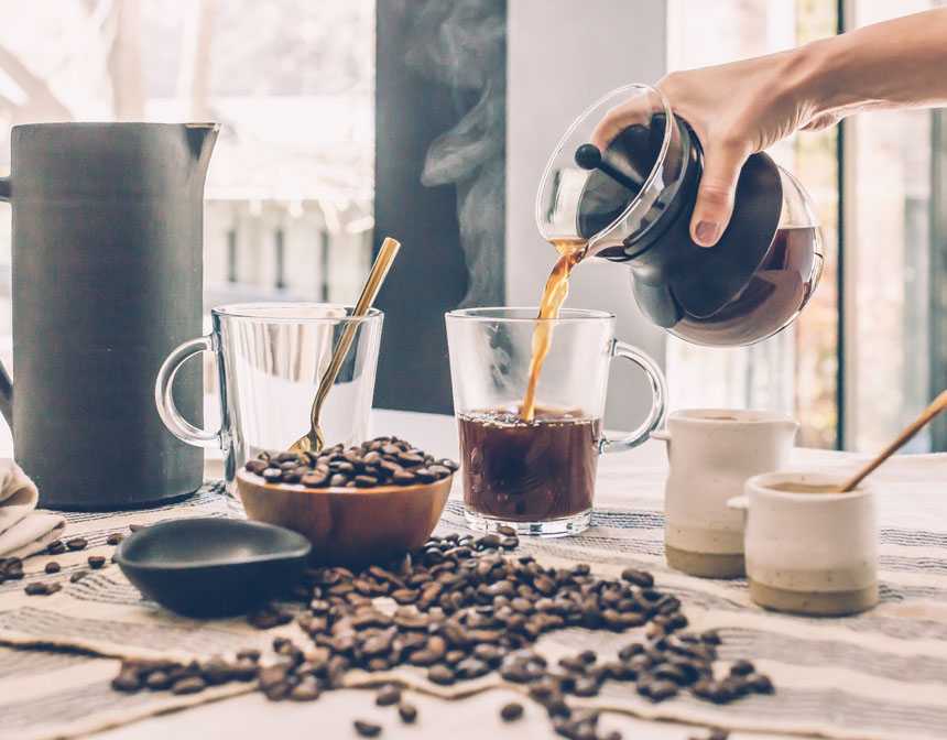 Coffee beans and coffee on the table