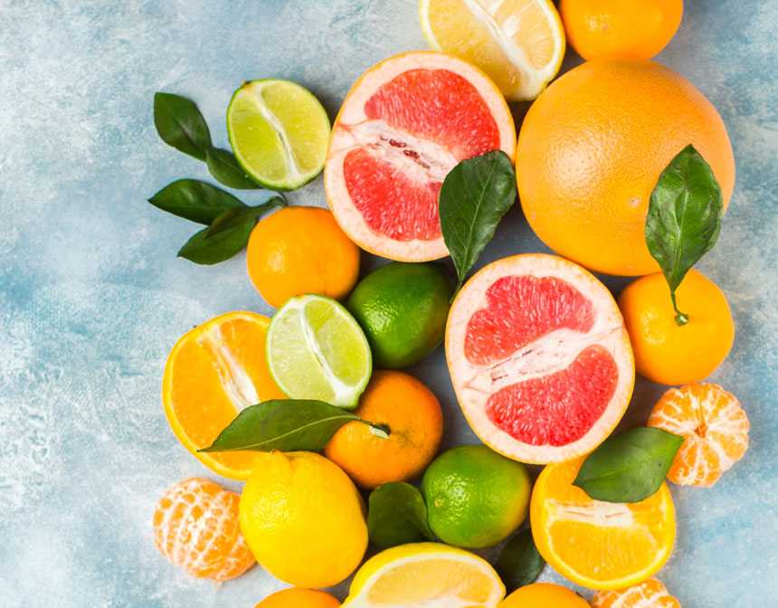 Cut oranges lemons and limes