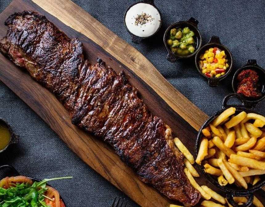 La Cabrera Steak with side dishes