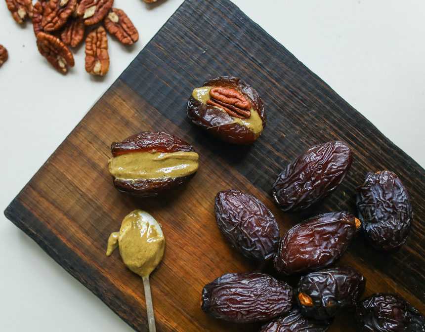 Photo of prunes on wooden surface