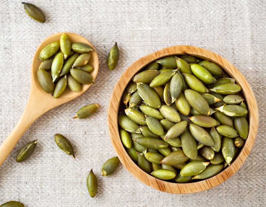 Pumpkin seeds in a wooden bowl