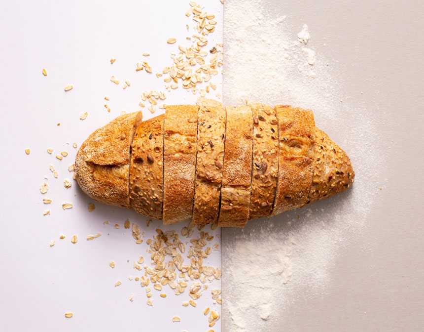 Sliced bread on white surface