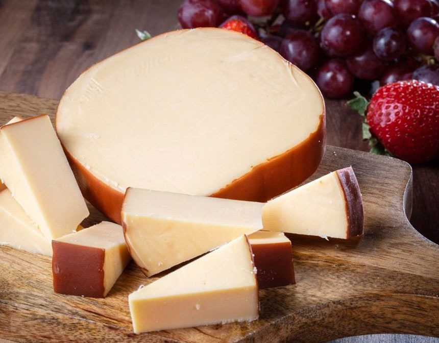 Smoked gouda near strawberry and grapes