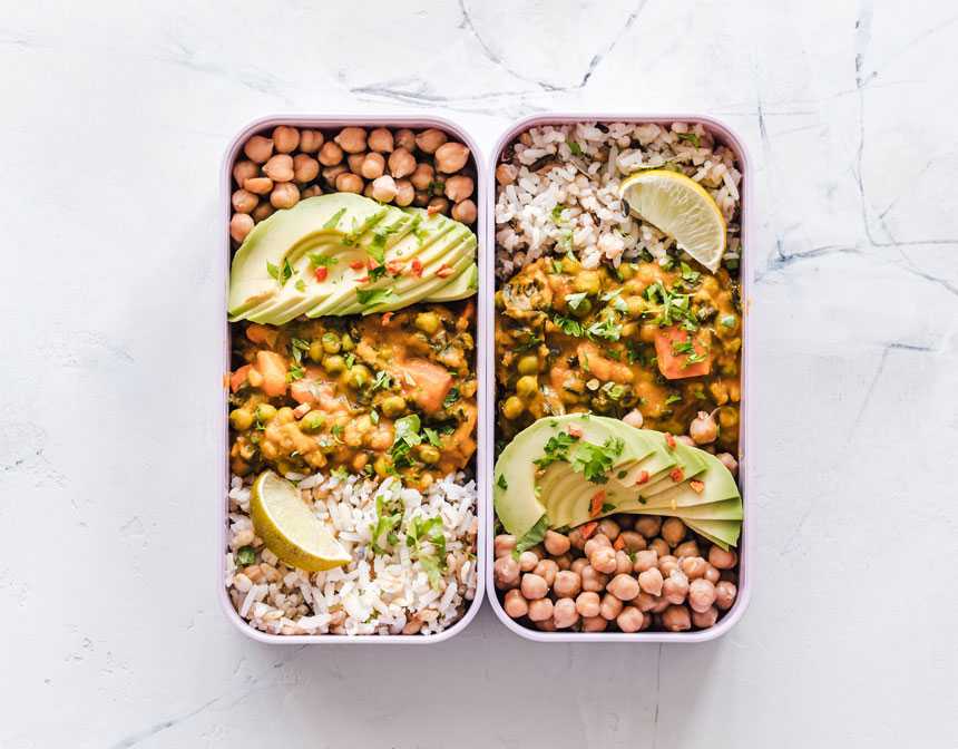 Vegan food with chickpeas rice avocado and lemon
