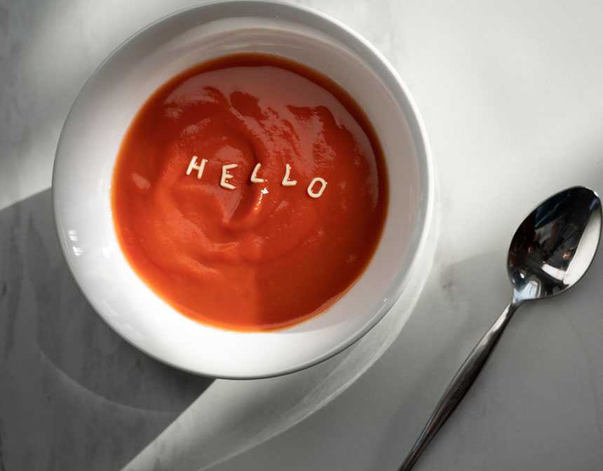 White ceramic bowl with tomato sauce